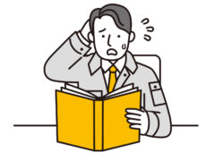 資料をみて困っている男性